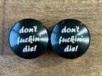 Don't Fuckin Die Smooth Black Front Axle Nut Covers for Harley Davidson Motorcycles